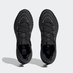 Top-down view of a pair of Adidas 4DFWD x Parley running trainers in black, highlighting their seamless knit construction and unique lacing.