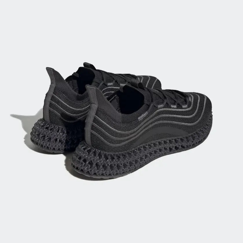 Rear angled view of two Adidas 4DFWD x Parley trainers in black, side by side, showcasing their groundbreaking 4D technology and Primeknit upper.
