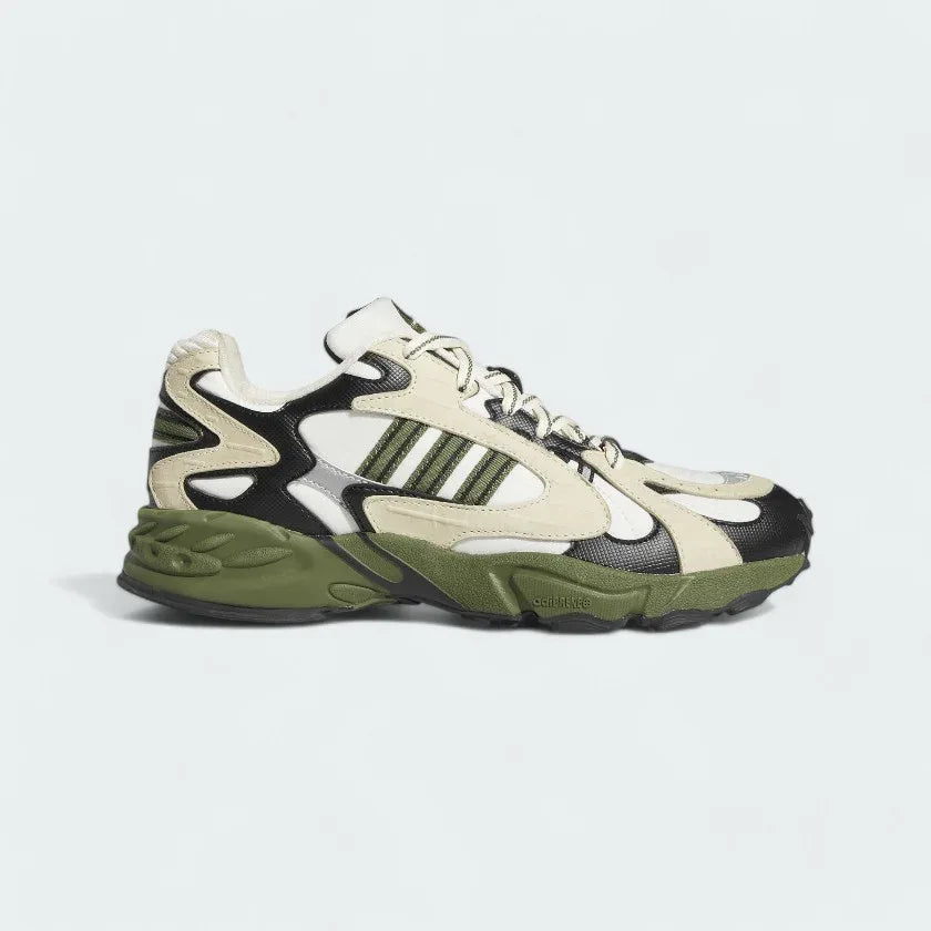 Adidas x Ivy Park Savage V4 men's sneakers in core white, wild pine green, and night indigo blue, side profile showing layered upper and Adidas 3-Stripes. Main image