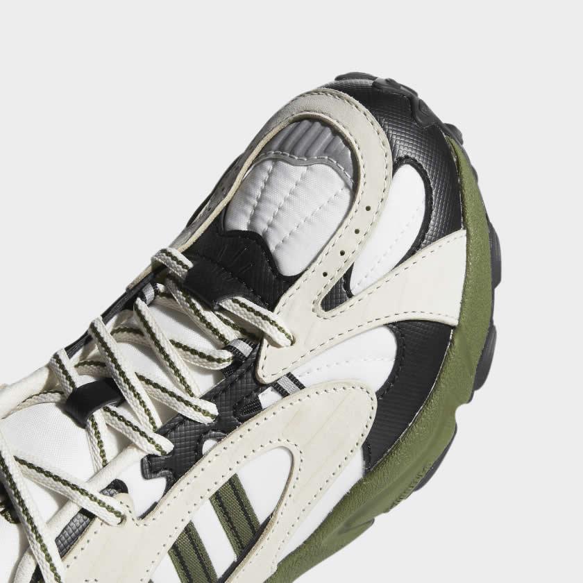 Close-up zoom on the front of the Adidas x Ivy Park Savage V4 sneakers, showing the mesh toe box, lacing system, and layered upper materials.