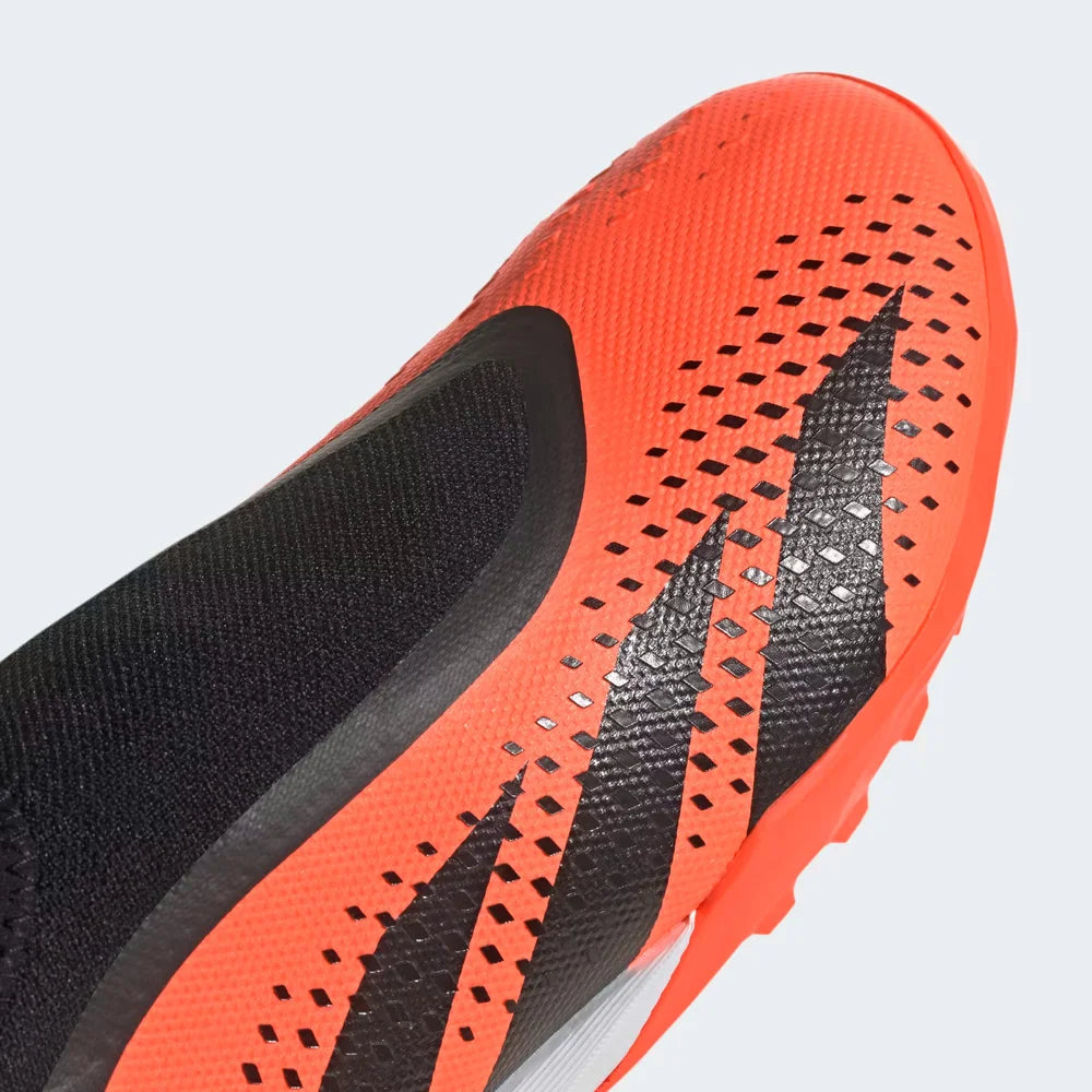 Close-up zoom on the laceless front of the Adidas Predator Accuracy.3 Turf Boots, showing the high-definition grip texture.