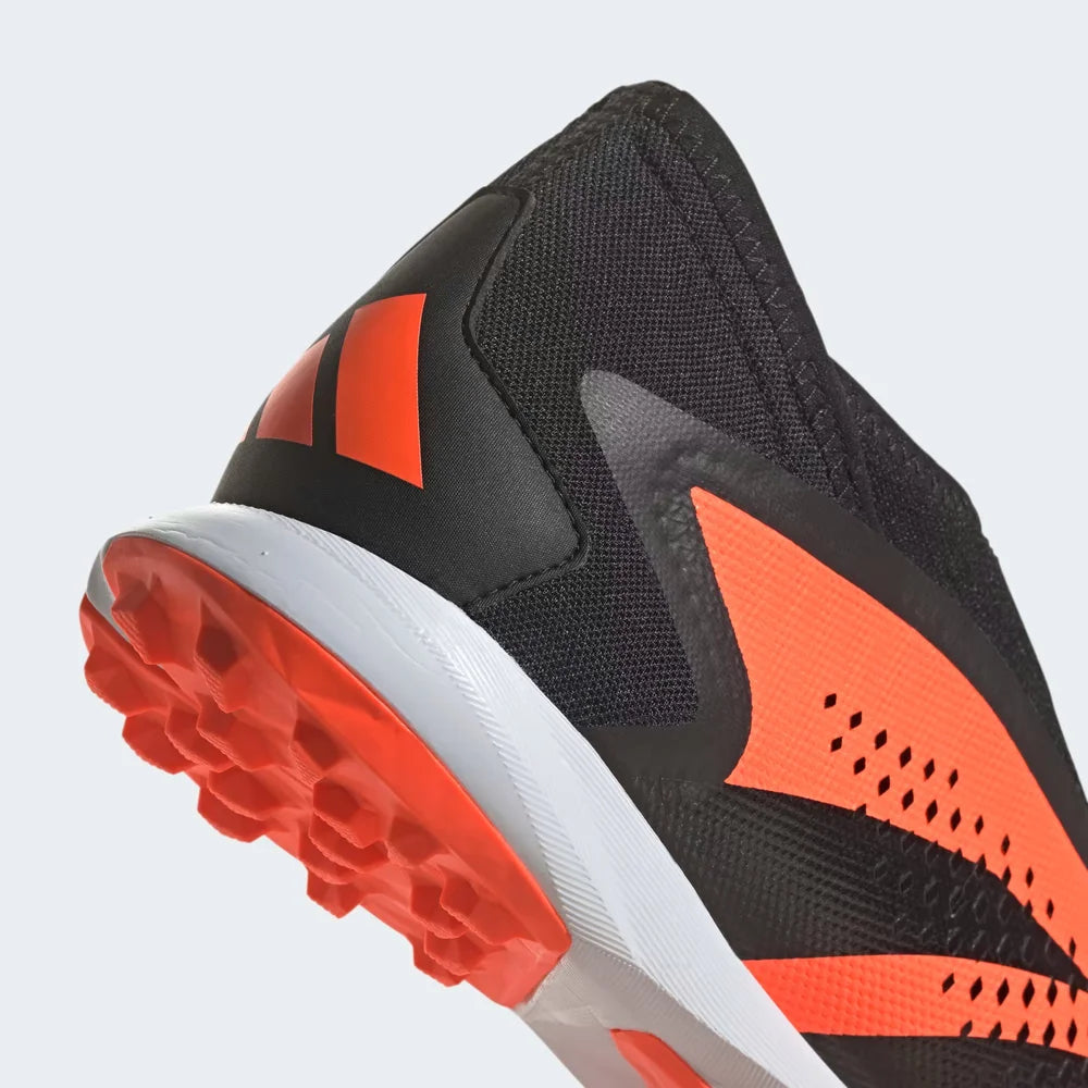 Detailed zoom on the outsole and midsole of the Adidas Predator Accuracy.3 Turf Boots, highlighting the cushioned material and the rubber turf sole.