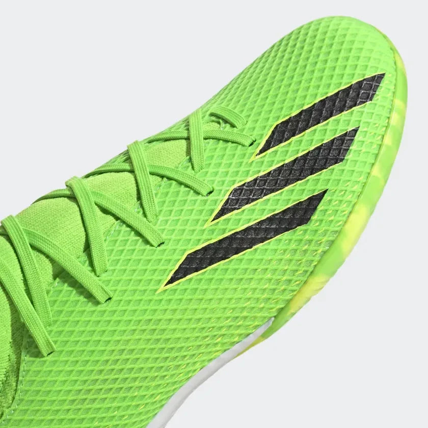 Close-up zoom on the front of the Adidas X Speedportal.3 Indoor Men's green boots, showing the coated textile texture, lacing system, and toe box.