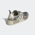 Rear view of the Adidas NMD_R1 women's shoes, focusing on the heel pull tab, moulded heel counter, and NMD midsole plugs.