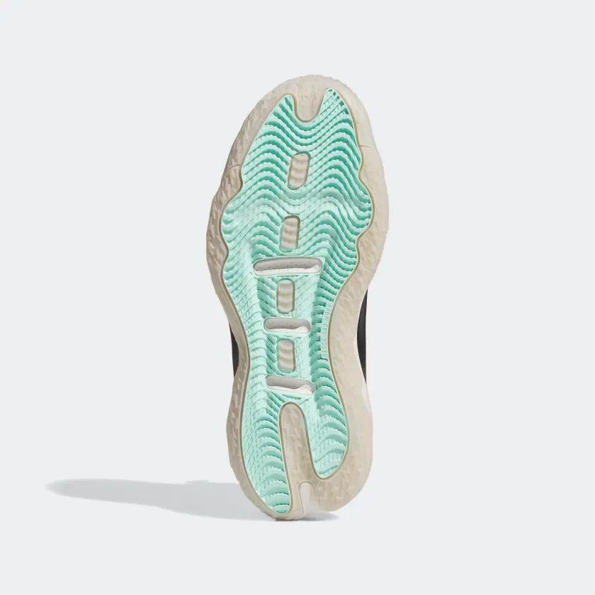 Displays the technical rubber tread pattern designed for unreal on-court grip and 360-degree traction.