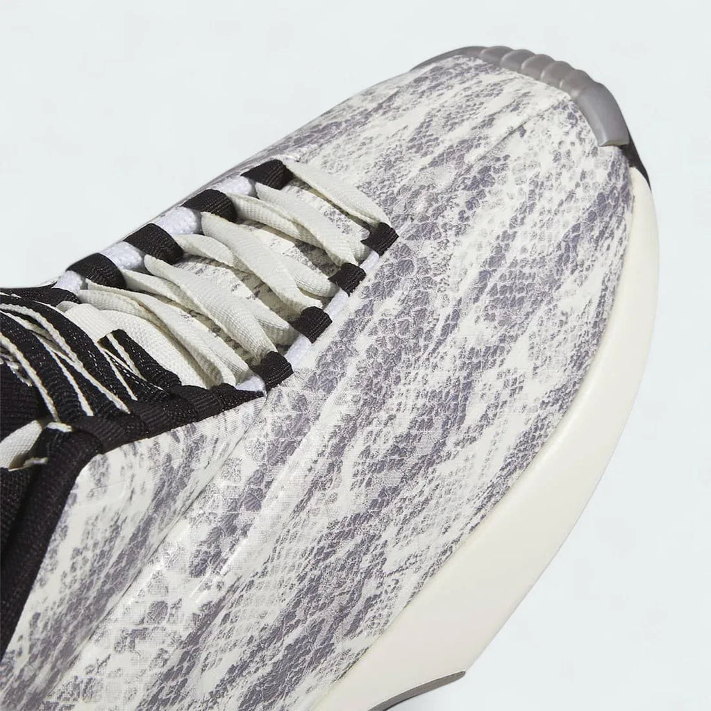 Close-up zoom on the front toe box of the Adidas Crazy 1 Men's "Snake Skin" trainers, detailing the moulded texture and white finish.