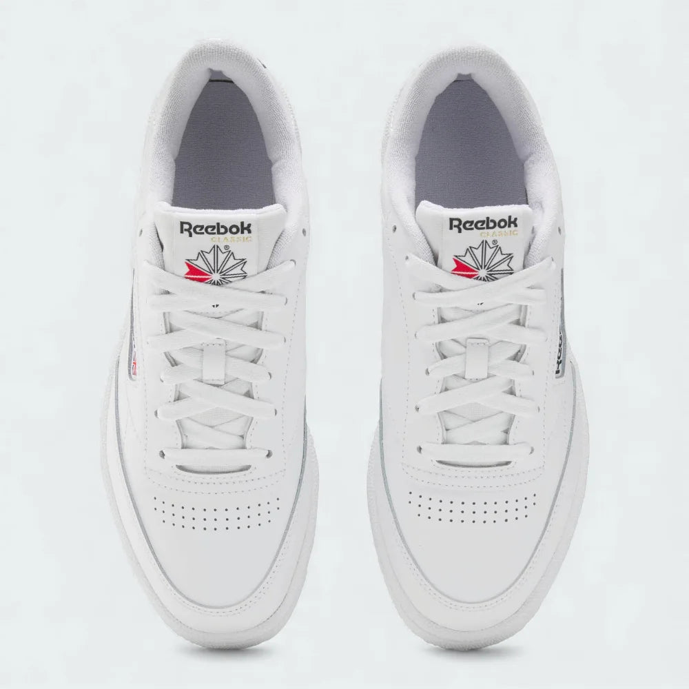 Top-Down view of a pair of Reebok Classic Club C 85 Unisex trainers in white, highlighting their clean shape and lace-up closure.