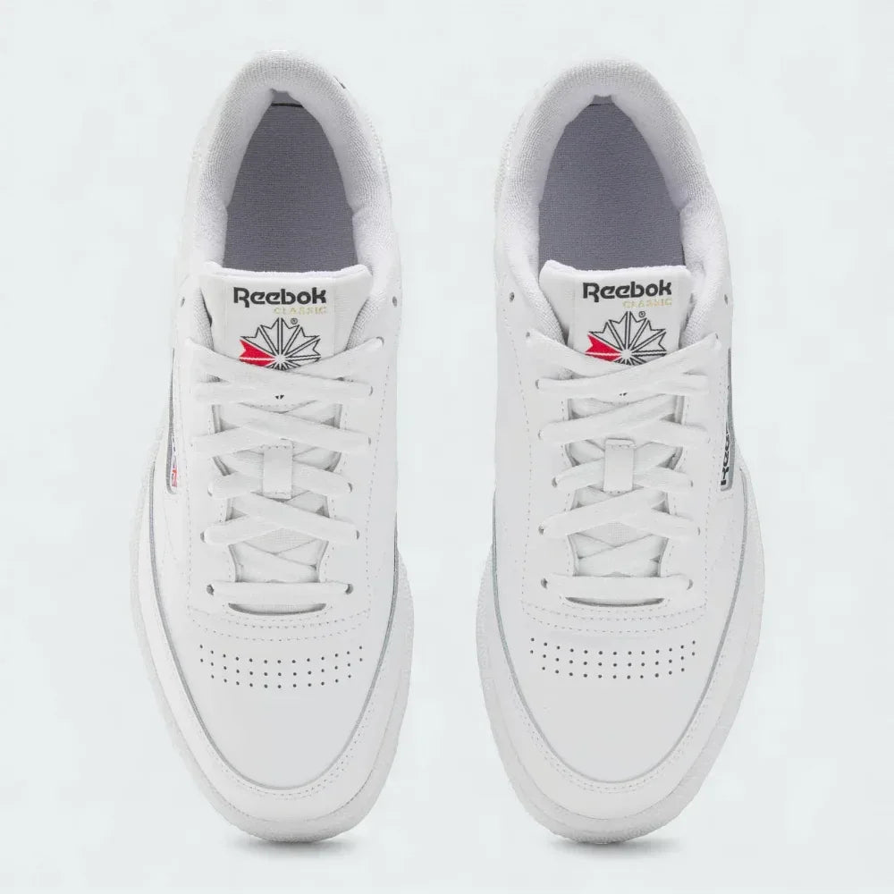 Top-Down view of a pair of Reebok Classic Club C 85 Unisex trainers in white, highlighting their clean shape and lace-up closure.