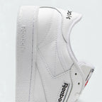 Detail view of the heel and collar of the Reebok Club C 85 trainers, illustrating the cushioning around the ankle opening and the supportive structure of the Cloud White leather.