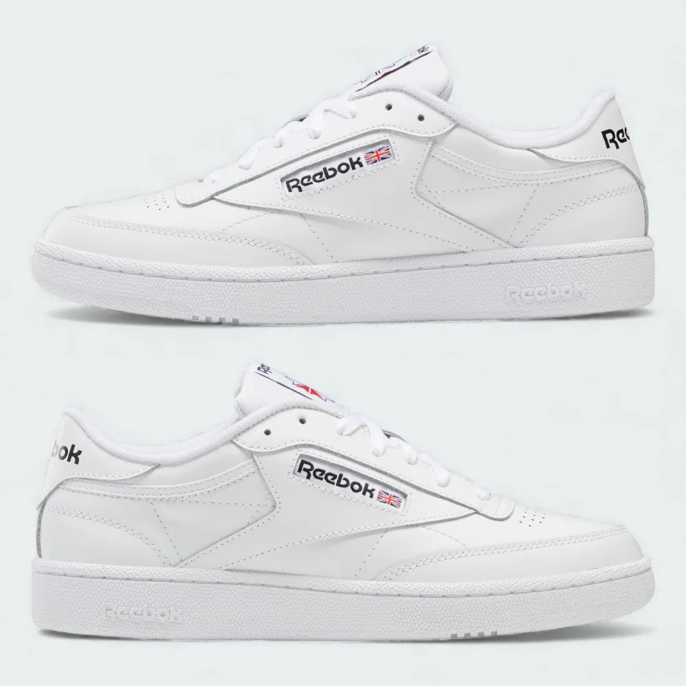 White Reebok sneakers on a light gray background