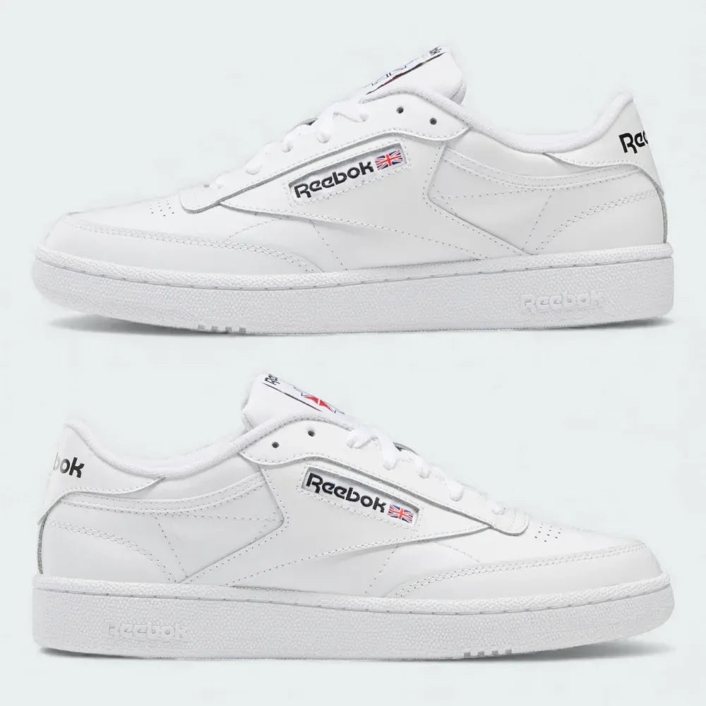 White Reebok sneakers on a light gray background