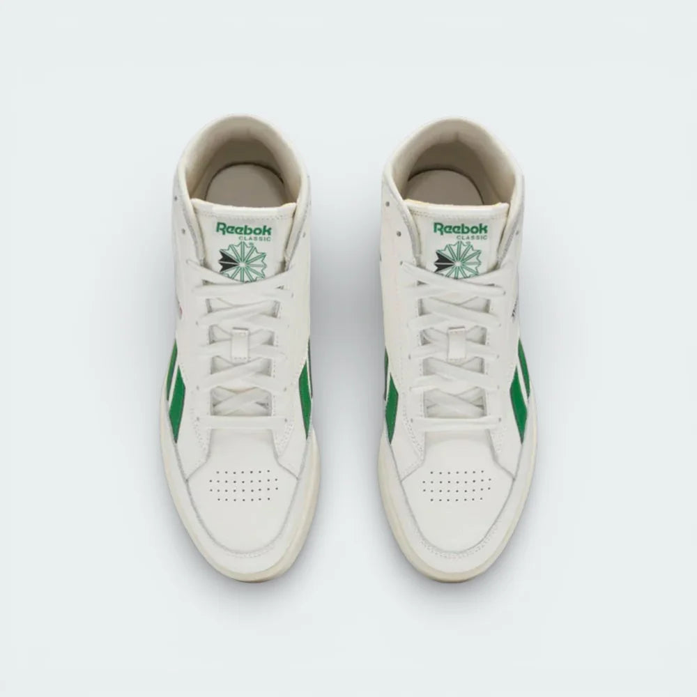 Top-down view of the off-white trainers, highlighting the clean leather toe box and the traditional lacing system extending up the ankle.