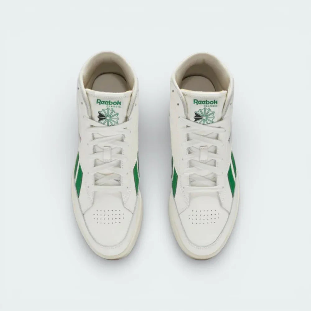 Top-down view of the off-white trainers, highlighting the clean leather toe box and the traditional lacing system extending up the ankle.