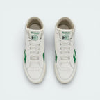 Top-down view of the off-white trainers, highlighting the clean leather toe box and the traditional lacing system extending up the ankle.
