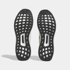 View of the outsole of the Adidas Ultraboost 1.0 x Marimekko running shoes, showing the durable Continental™ rubber tread pattern and the visible Boost cushioning.