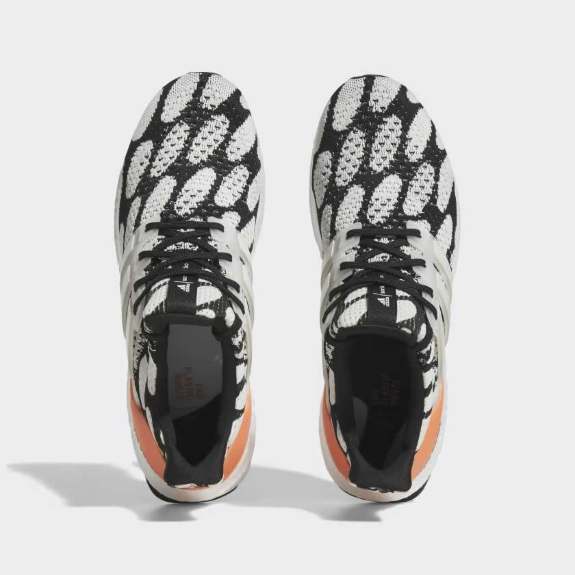Top-down view of a pair of Adidas Ultraboost 1.0 x Marimekko running shoes, highlighting their sock-like fit, lace-up closure, and all-over graphic print.