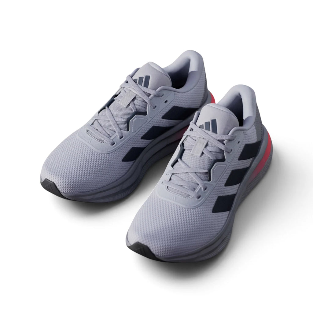 Angled front-three-quarter perspective capturing the reinforced toe box, technical mesh texture, and smooth transition into the cushioned midsole.