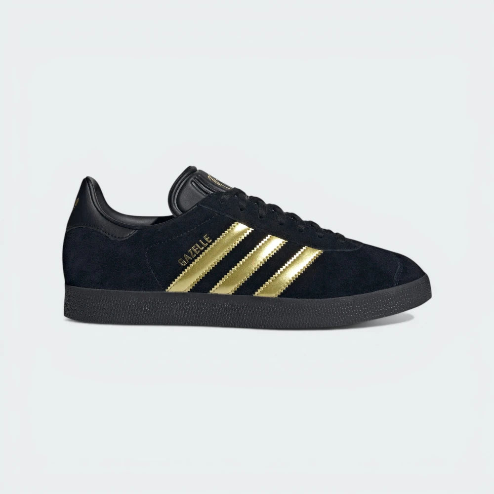 The Core Black Bellingham Gazelle, highlighting the Gold Metallic 3-Stripes and the Jude Bellingham logo on the lateral side.