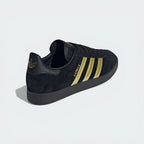 Focusing on the sleek black heel tab and the seamless transition into the black outsole.