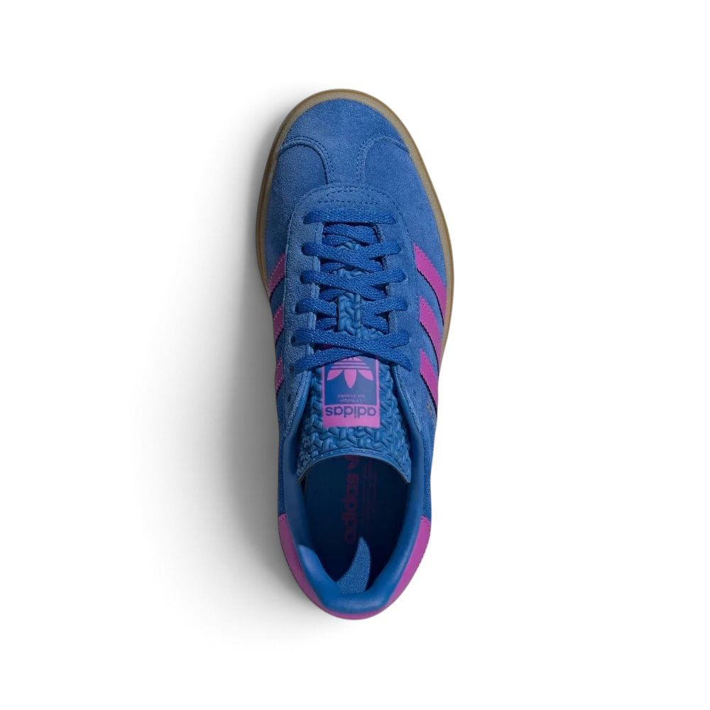 Focuses on the tidy lace closure, the clean alignment of the textured blue tongue, and the iconic T-toe configuration covering the front box.