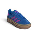 Emphasising the elevated platform stance and the professional harmony of the rich blue suede against the vivid purple accents.