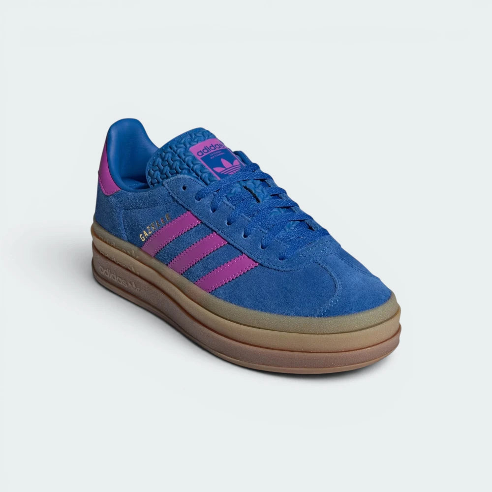 Emphasising the elevated platform stance and the professional harmony of the rich blue suede against the vivid purple accents.