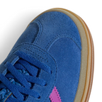 Details the premium stitching lines across the soft blue suede toe cap and the precision lace eyelet layout.