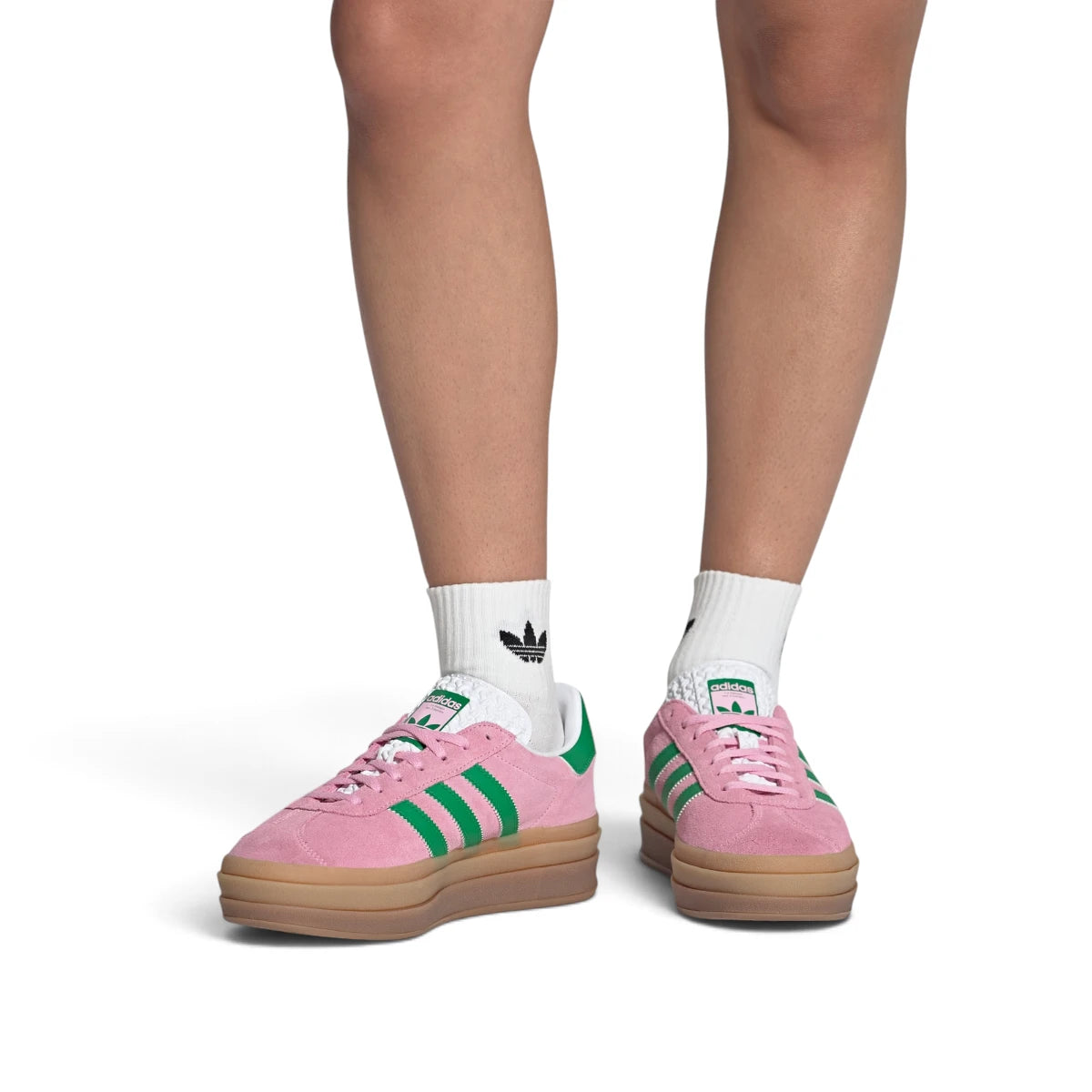Lifestyle / On-Foot View: Shot of the shoes worn on feet with white socks, demonstrating the statement proportions and vibrant colour blocking of the platform trainers in a real-world setting.   