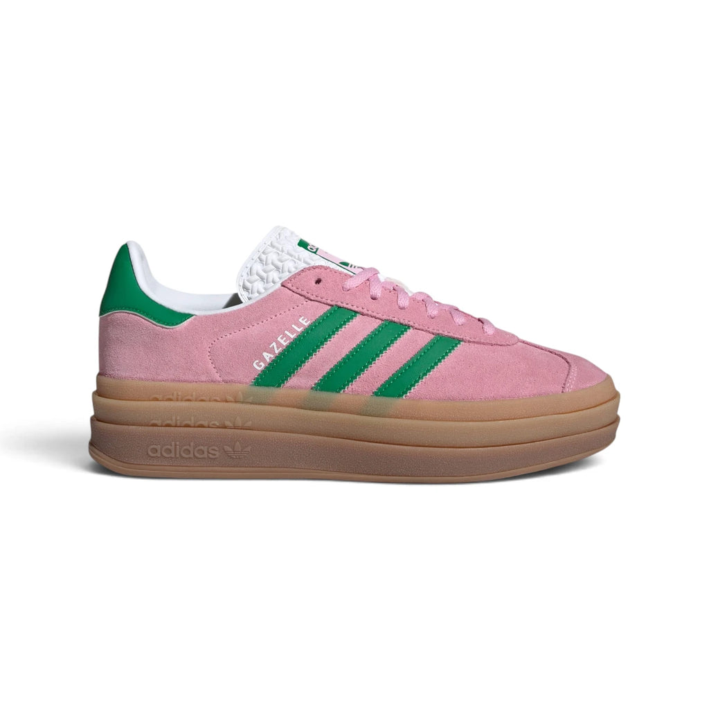 Side Profile Image: Studio lateral shot of the adidas Gazelle Bold in True Pink and Green, highlighting the soft pink suede upper, green serrated three stripes, gold foil Gazelle branding, and the triple-stacked gum rubber platform midsole.   