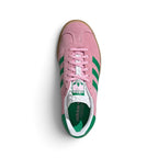 Top-Down View of Pair: Overhead view looking down at the laced pink shoes, displaying the pink flat laces, patterned tongue label with the green Trefoil logo, and the contrast green interior lining.   