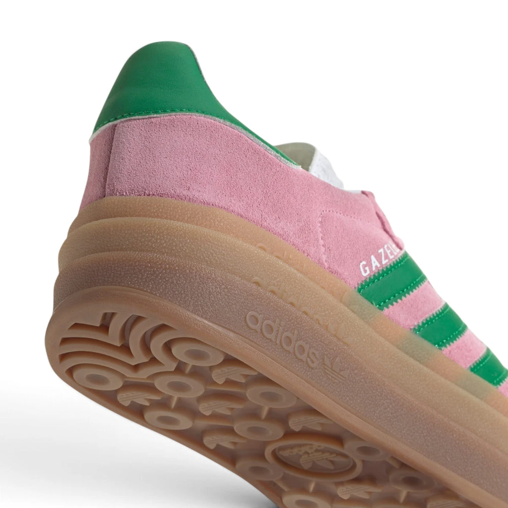 Zoom Looking at the Heel and Outsole: Detailed close-up angle capturing the debossed adidas branding on the triple midsole layers and the textured grip of the gum outsole.   