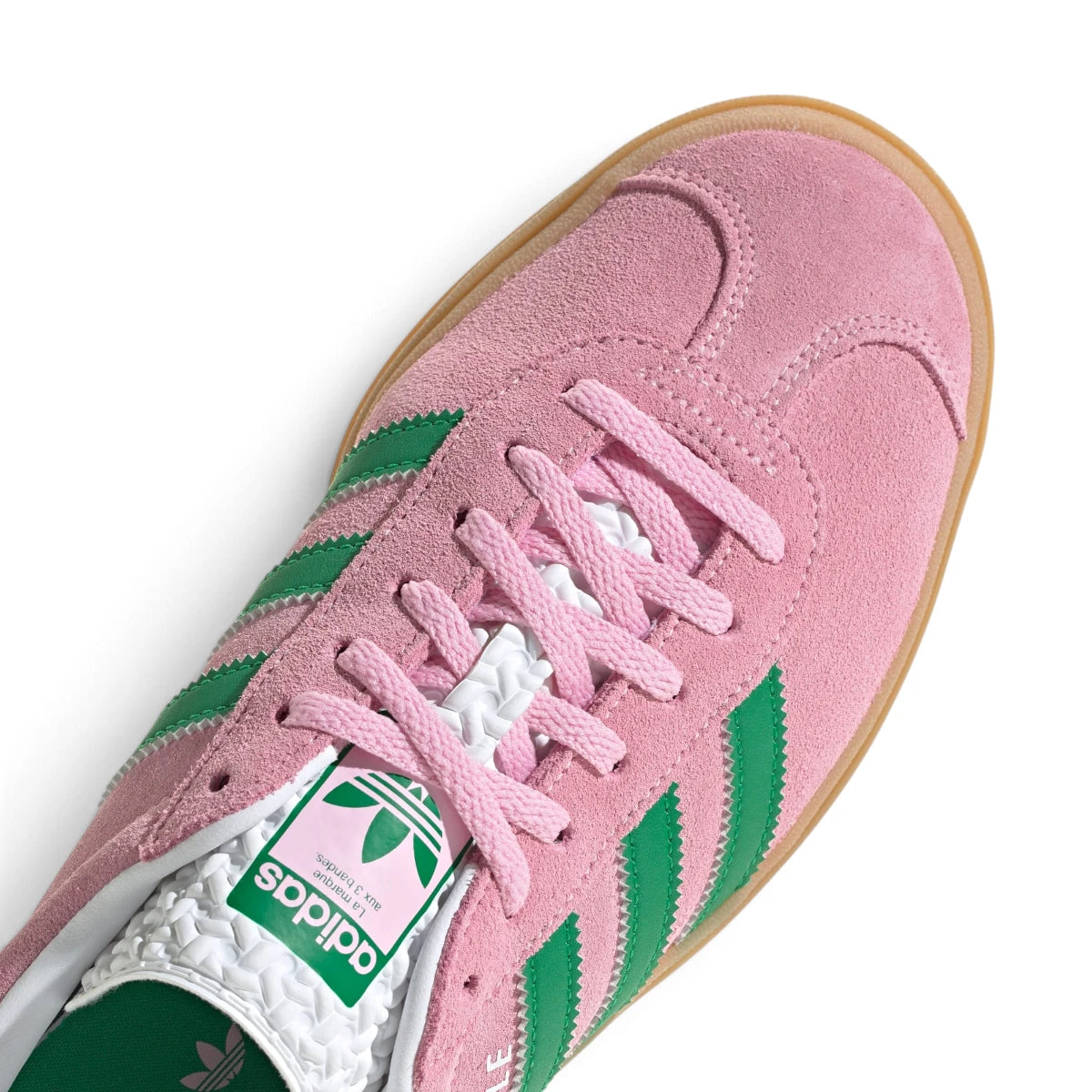 Zoom Looking at the Front and Laces: Macro focus on the suede toe cap, pink flat laces, and the textured white tongue label.   