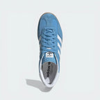 Top-Down View of Pair: Looking down at the light blue suede lacing system and the textured tongue branding.
