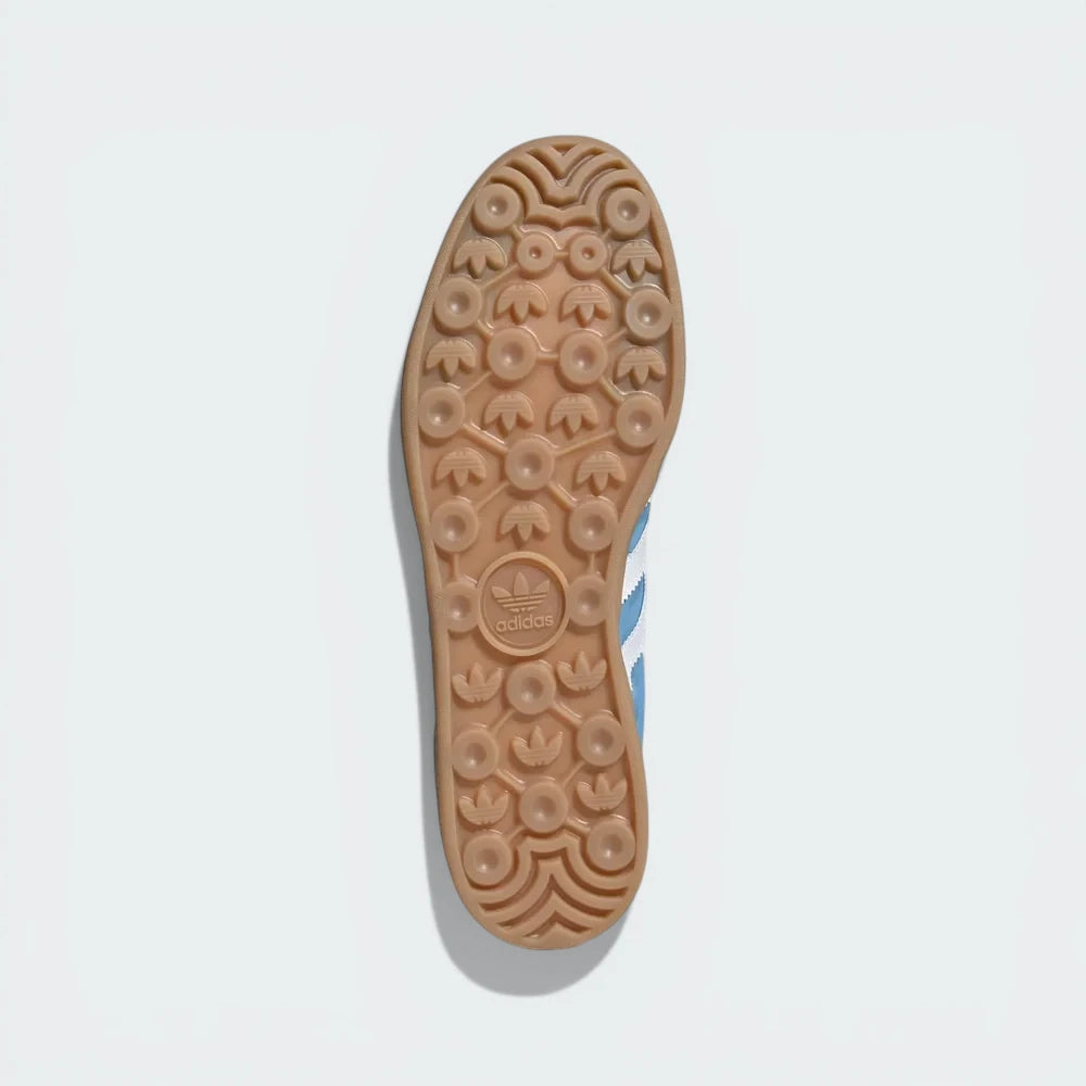 Outsole View: Showing the signature Adidas-patterned traction on the durable, translucent gum rubber sole.