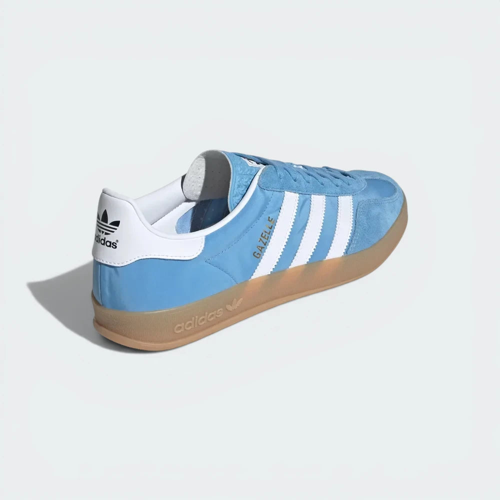 Focusing on the Cloud White heel tab and the unique wrap-around design of the gum sole.
