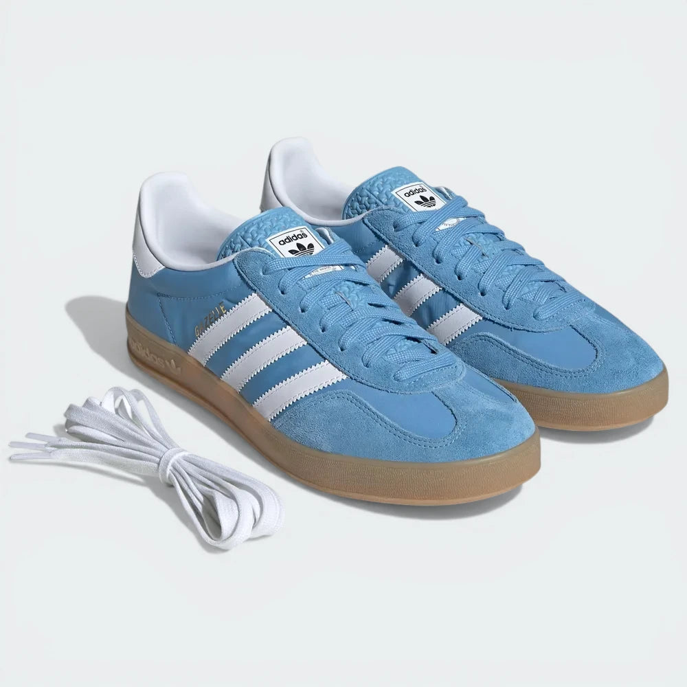 Angle View Showing Both Pair Side by Side: Emphasizing the iconic T-toe overlay and the clean, airy colour blocking and spare laces