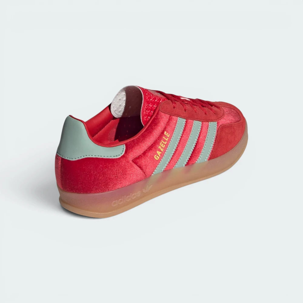 Focuses on the contoured shape of the Hazy Green leather heel tab and the clean, translucent wrap finish of the low-profile gum sole wall.