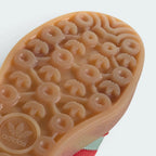 Silicone scrubber with Adidas logo on a white background