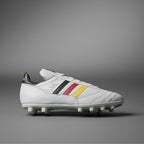 White soccer cleat with colorful stripes on a gray background