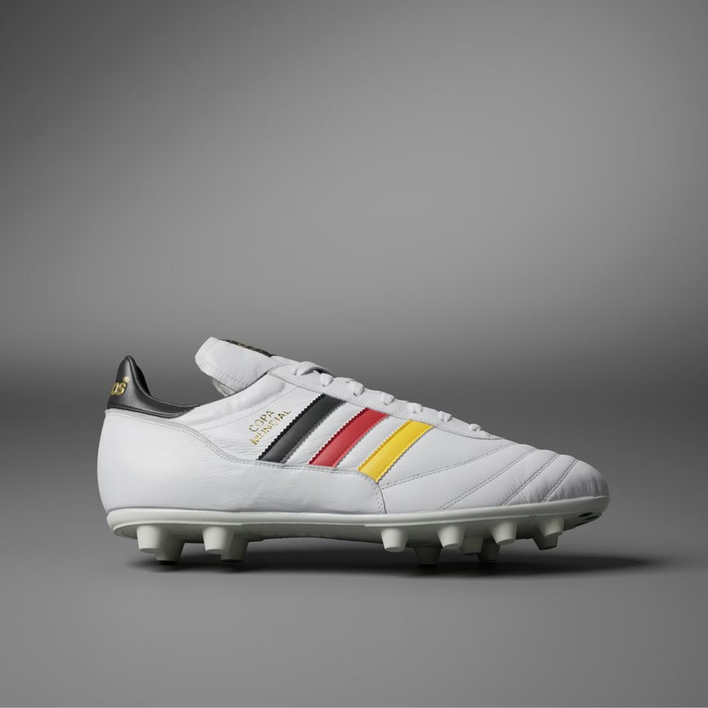 White soccer cleat with colorful stripes on a gray background