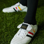 A close-up of the reinforced stitching on the leather toe box and the quality of the white laces.