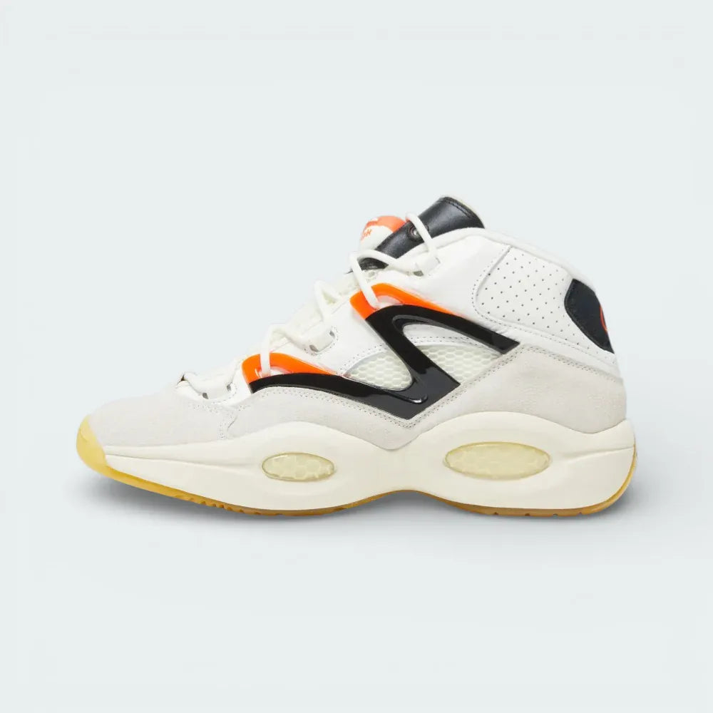 Looking from the side, showing the grey suede toe cap, the detailed mesh construction, and the secure lacing system.