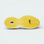 View of the yellowed translucent rubber outsole, showcasing the heritage traction pattern and the visible Hexalite window.