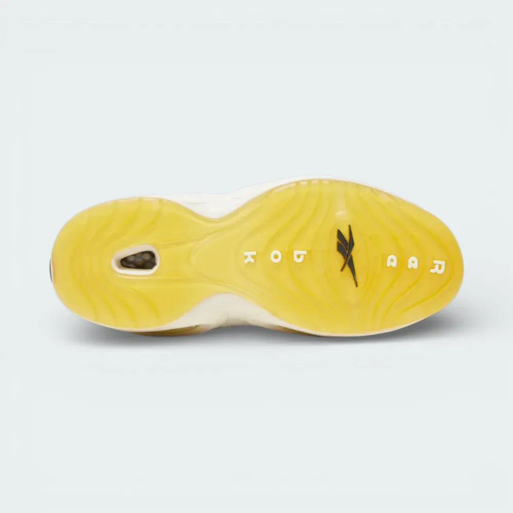 View of the yellowed translucent rubber outsole, showcasing the heritage traction pattern and the visible Hexalite window.
