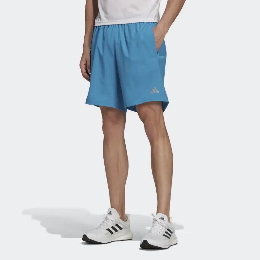adidas Men's Run It Running Shorts H36473 worn standing showing athletic fit and clean design