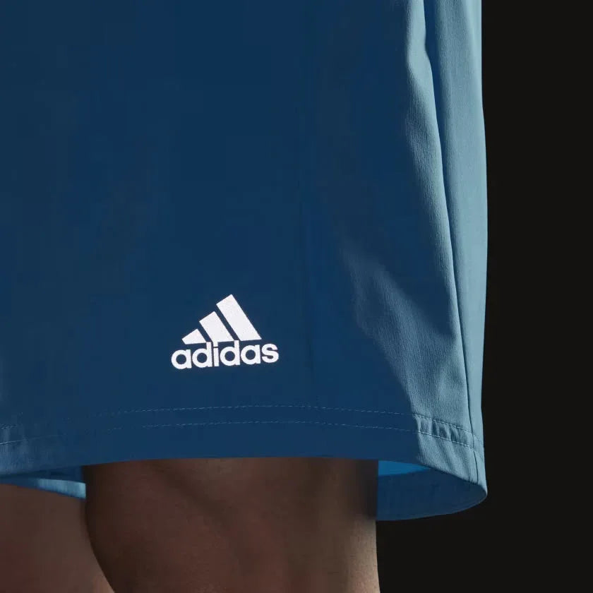 Close-up of adidas Men's Run It Running Shorts H36473 moisture-wicking fabric and logo detailing