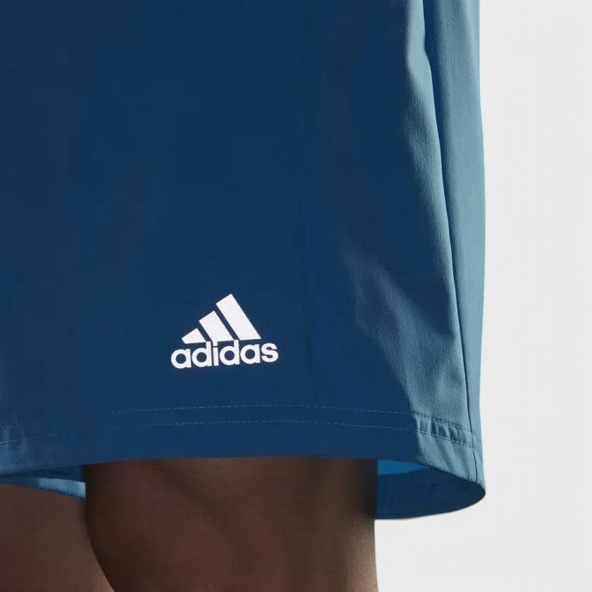 Close-up of adidas Men's Run It Running Shorts H36473 moisture-wicking fabric and logo detailing