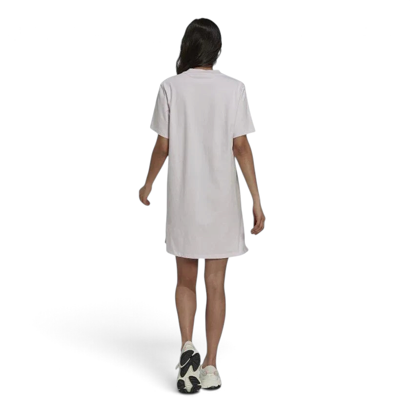 Adidas Tennis Luxe Tee Dress Women's in ambient blush pink, back view on a model, highlighting the loose drape and comfortable silhouette.