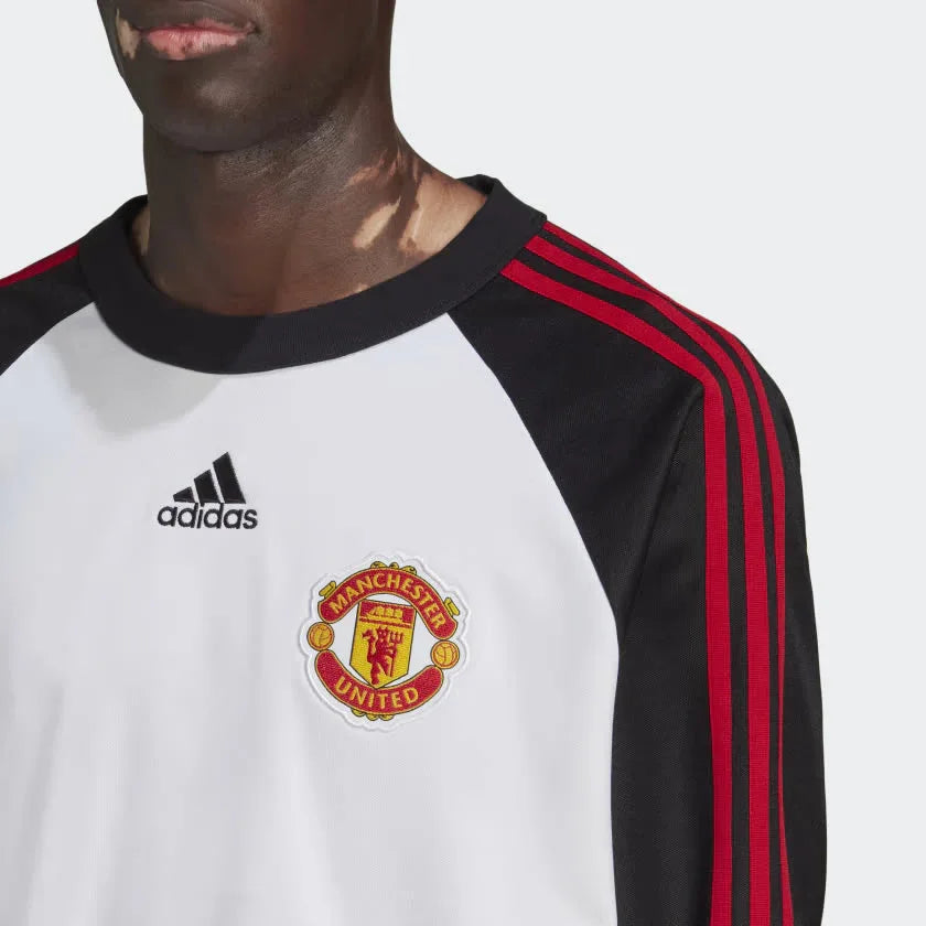 A close-up of the premium embroidered Manchester United badge.