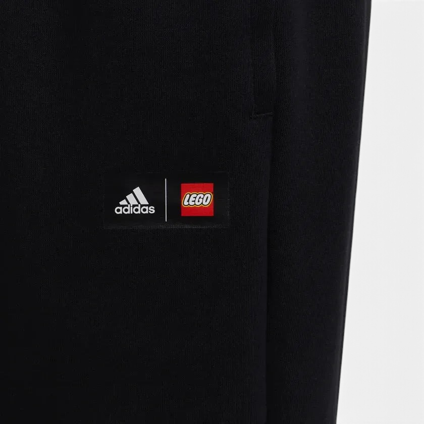 Trade Sports black Adidas x LEGO VIDIYO track pants featuring a collaborative logo patch on the leg